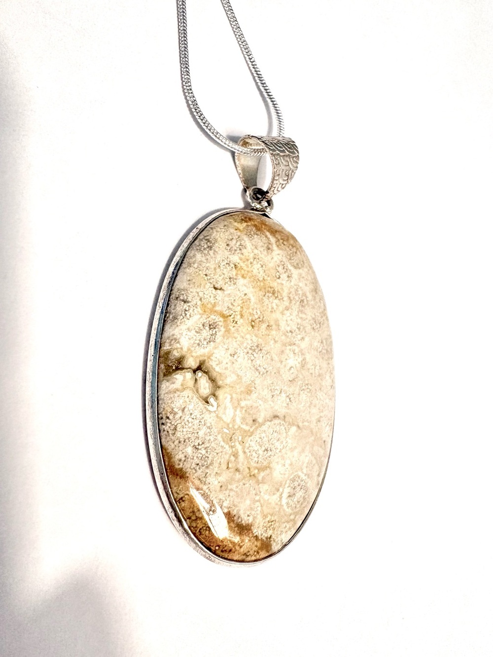 Beautiful, 2 1/4 inch, Fossil Coral pendant on a silver chain.